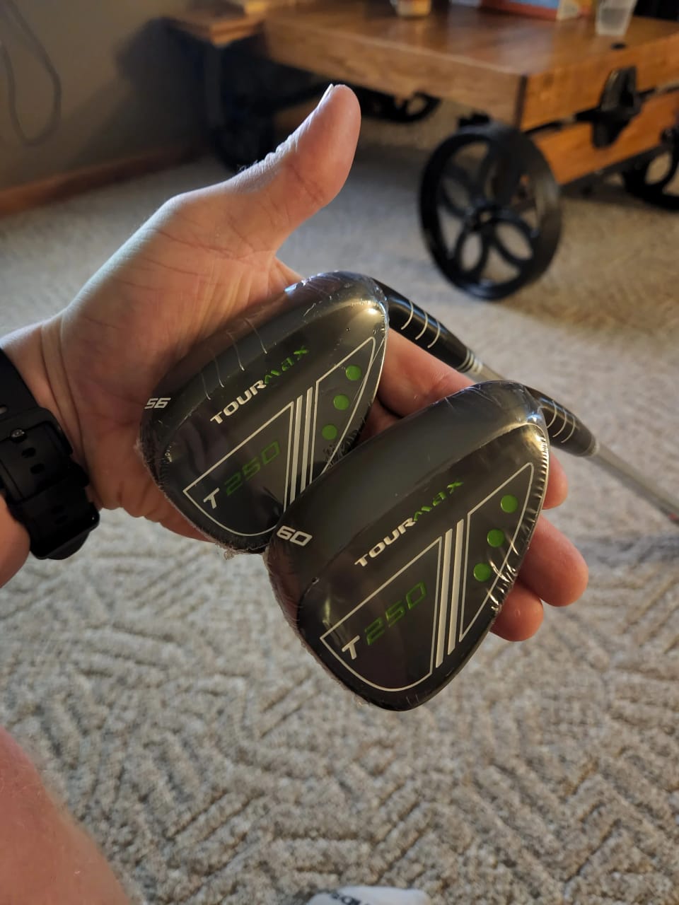 Two restored wedges held in hand, faces cleaned and grooves sharp